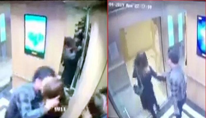 Nữ sinh bị gã đàn ông cưỡng hôn trong thang máy. Ảnh cắt từ clip.