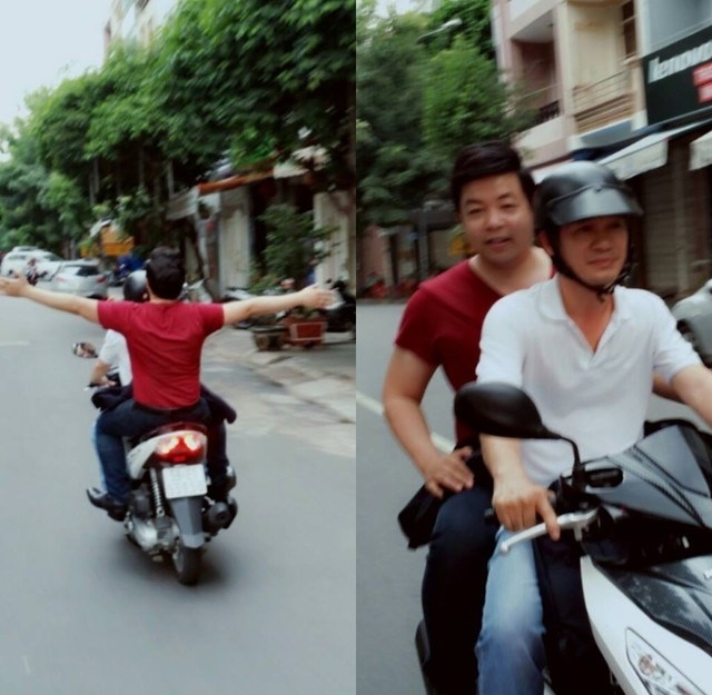 Quang Lê không đội mũ bảo hiểm khi tham gia giao thông đã đành còn giang hai tay khi đang ngồi trên xe máy khi xe chạy.