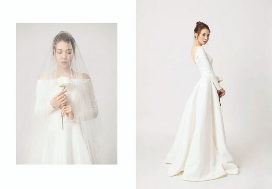 Đàm Thu Trang xinh đẹp rạng rỡ khi khoăc lên mình chiếc váy trắng tinh khôi của cô dâu.