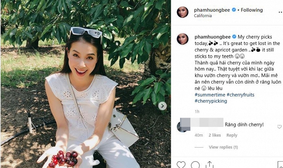 Hoa hậu Phạm Hương thích thú khoe khoảnh khắc vui vẻ khi hái cherry. Người đẹp cũng cho biết vì mải mê ăn nên cô để cherry dính ở răng.  