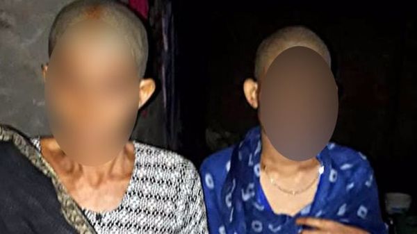 2 mẹ con người phụ nữ bị nhóm người cạo đầu. Ảnh: BBC