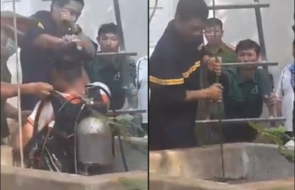 Cơ quan chức năng đưa thi thể nạn nhân lên khỏi giếng sâu.