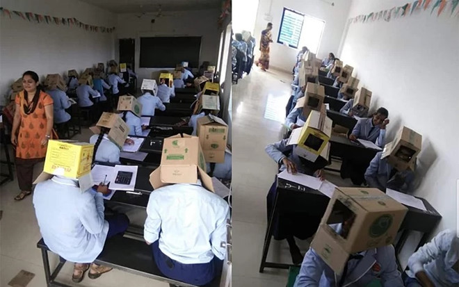 Hàng chục sinh viên đội thùng carton làm bài thi.