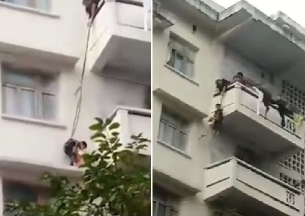 Cặp vợ chồng buộc cháu trai vào sợi dây để thả xuống tầng 4 giải cứu con mèo.