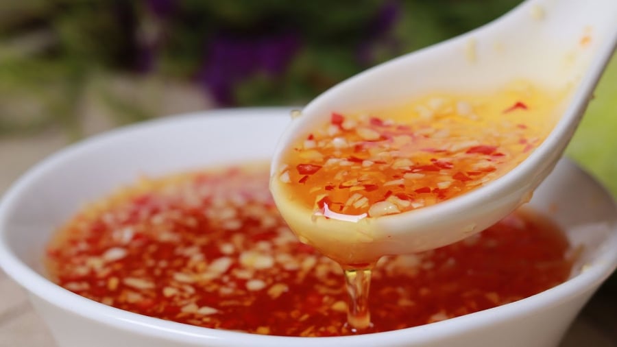 dipping sauce with garlic and chili on top