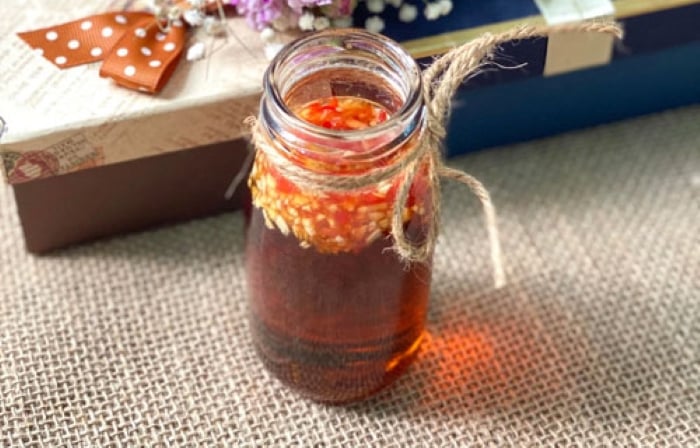 Sweet and sour fish sauce in a glass bottle