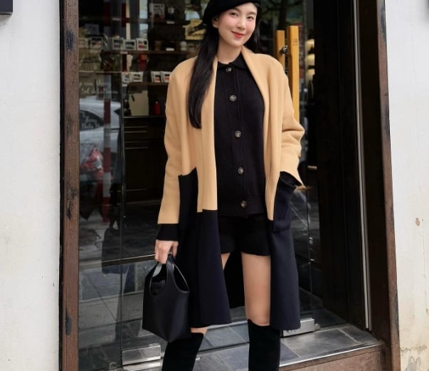 Mai Ngọc ghi điểm với set đồ mùa đông gồm áo cardigan, quần short và boots cao cổ mang tông màu trung tính.