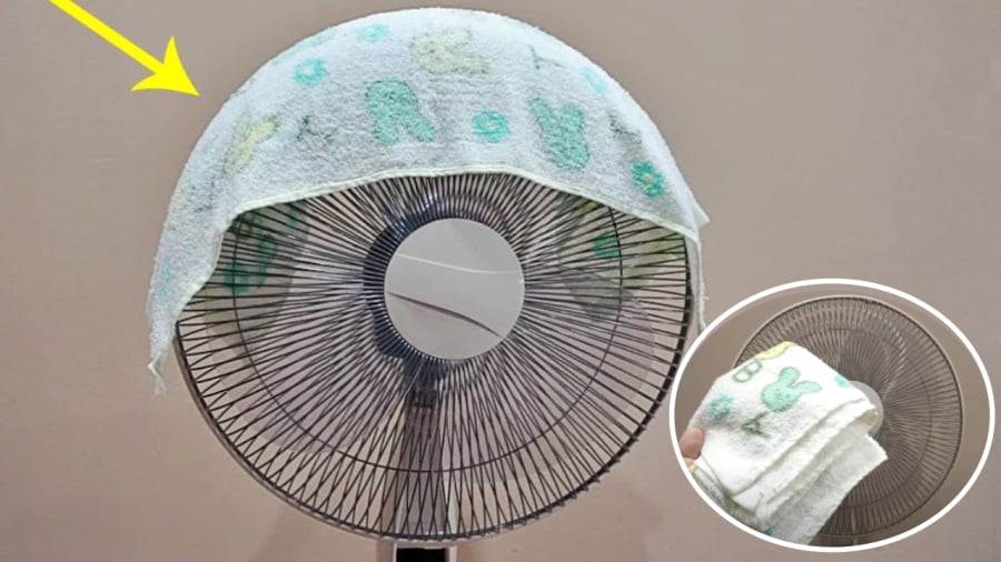 Đắp khăn lên quạt điện giúp tăng hiệu quả làm mát trong mùa hè.