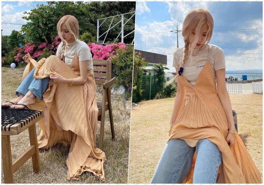Sự kết hợp giữa váy xẻ tà và quần ống rộng mang đến một tổng thể hài hòa nhưng không kém phần nổi bật.