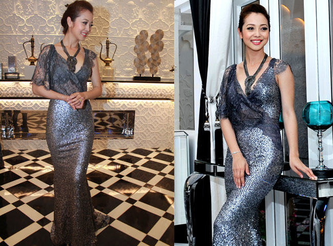 Hoa hậu Jennifer Phạm thu hút mọi ánh nhìn khi xuất hiện trong chiếc váy thiết kế độc đáo, thân trên là vải ren mỏng manh, nhìn xuyên thấu cả nội y còn chân váy đính vảy kim tuyến lấp lánh.