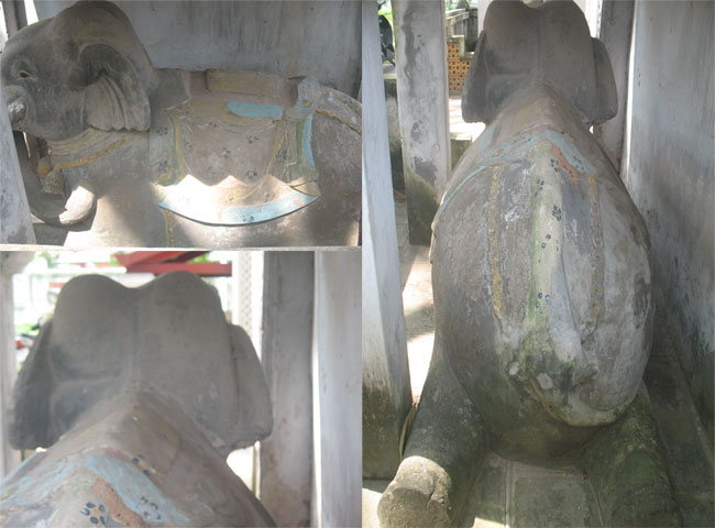 Chú voi phục bên phải cổng đền bị nứt tai, khiến đôi tai chú bị lệch. Ảnh chụp ngày 22/9/2012