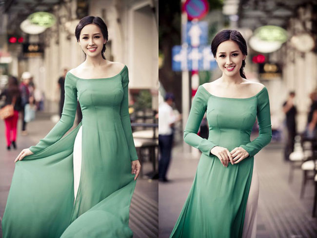 Trong sắc xanh nhẹ nhàng của tà áo truyền thống, Hoa hậu Việt Nam 2006 tung tăng trên phố đông người, rộn ràng đón Tết 