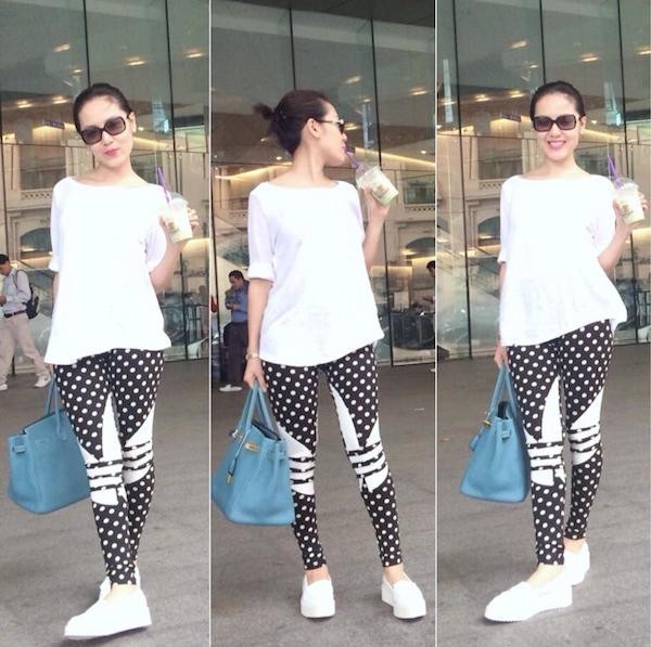 Trang phục xuống phố của Phương Linh với legging chấm bi, giày thể thao và áo thun trắng.