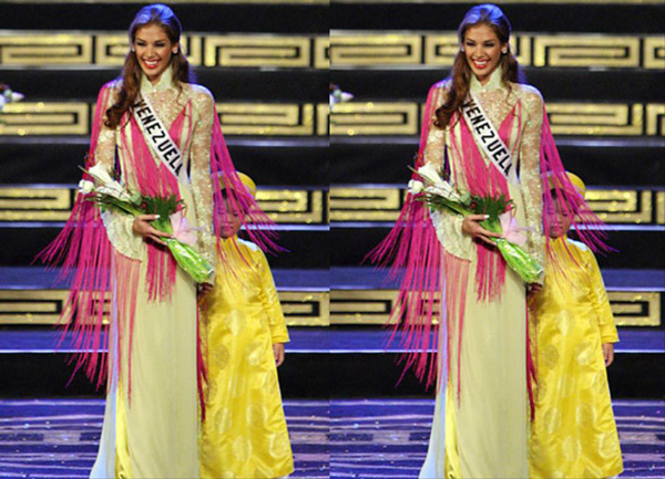 Hoa hậu Hoàn vũ 2008 Dayana Mendoza ngất ngây với áo dài vàng.