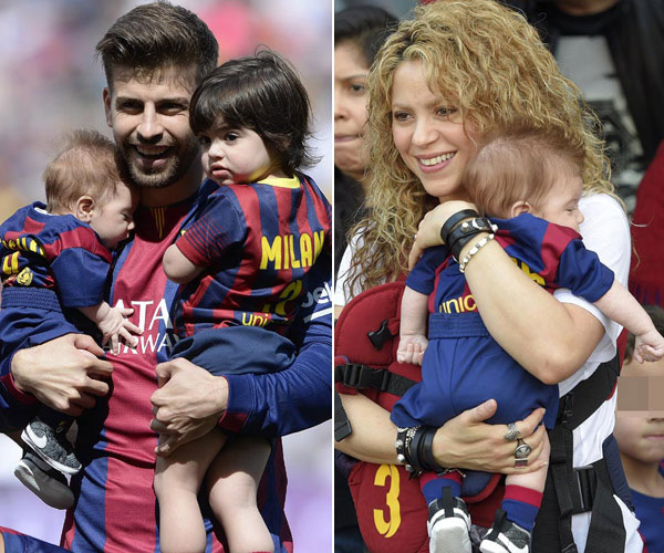 Pique và Shakira bên hai cậu con trai trong trận một trận đấu.