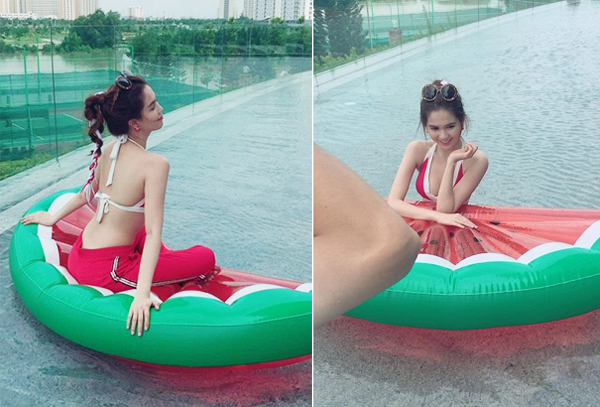 Ngọc Trinh sexy khoe thân hình mảnh mai trong hậu trường một buổi chụp ảnh trên hồ bơi.