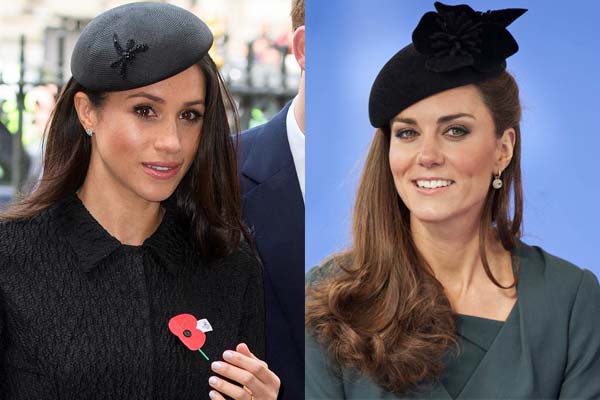 Cùng chọn mũ nồi để đội, nhưng mũ của Meghan Markle chỉ đính thêm hình nhỏ xinh còn của Kate Middleton cầu kỳ với bông hoa to bản gắn trên mũ.    