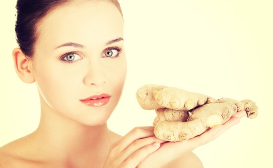 woman-with-whole-ginger-root