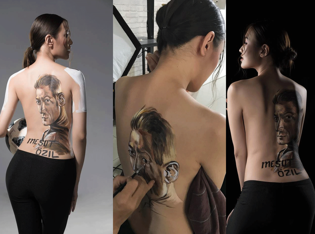 Hot girl xứ Nghệ lột áo, vẽ hình tiền vệ Mesut Ozil lên lưng để cổ vũ thần tượng