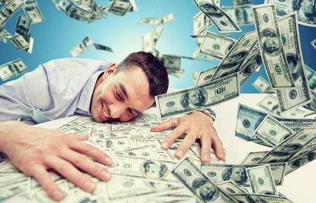 62397566-business-people-success-and-fortune-concept-happy-businessman-with-heap-of-dollar-money-over-blue-ba