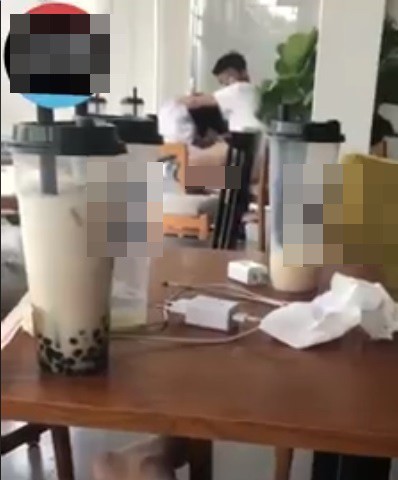 Hình ảnh đôi nam nữ 15 tuổi thản nhiên làm chuyện người lớn trong quán trà sữa ở Lạng Sơn. 