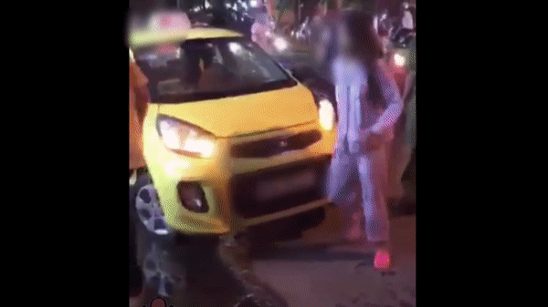 Cô gái đuổi đánh tài xế.