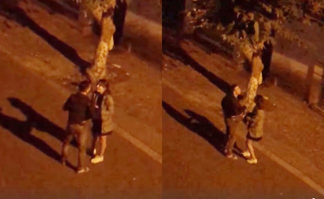 Cặp đôi giằng co, tranh cãi trên phố lúc nửa đêm.