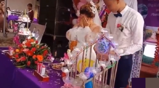 Mở nắp rượu sâm panh bắn vào mặt khiến cô dâu bật khóc, chú rể còn có thái độ bất ngờ
